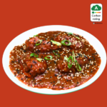 Chilli Momos in Spicy Sesame Tomato Sauce