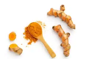 turmeric plant and ground powder
